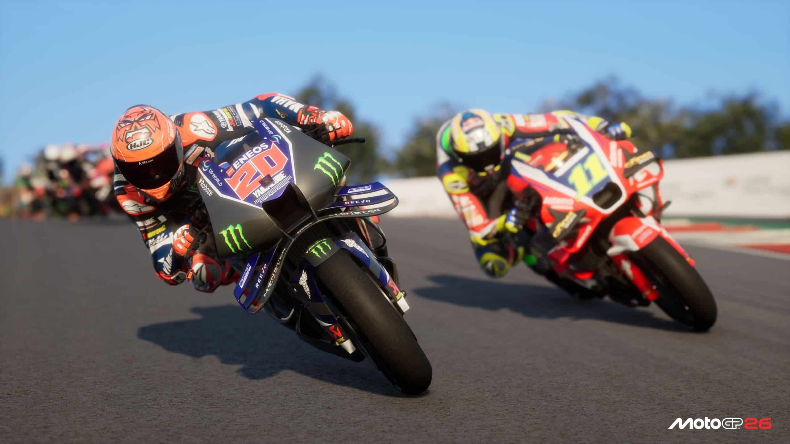 MotoGP 26 gameplay avec deux pilotes en pleine attaque en virage sur circuit, rendu réaliste et dynamique